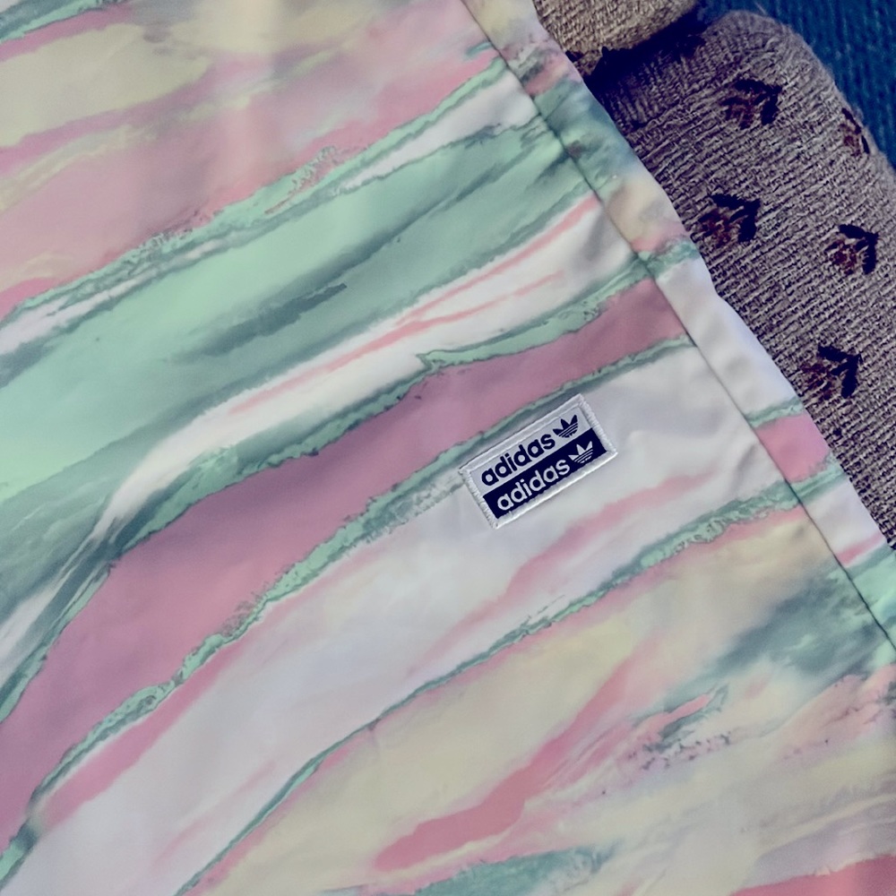 Adidas kinda wind pants but a little softer w/o the inner lining wind pants had